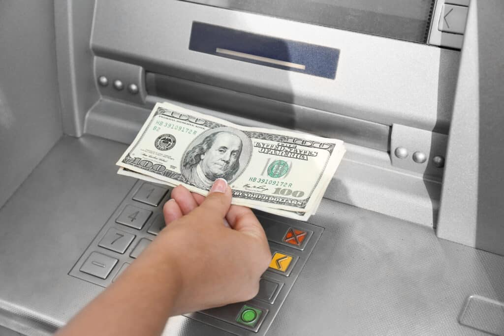 Woman withdrawing money from ATM