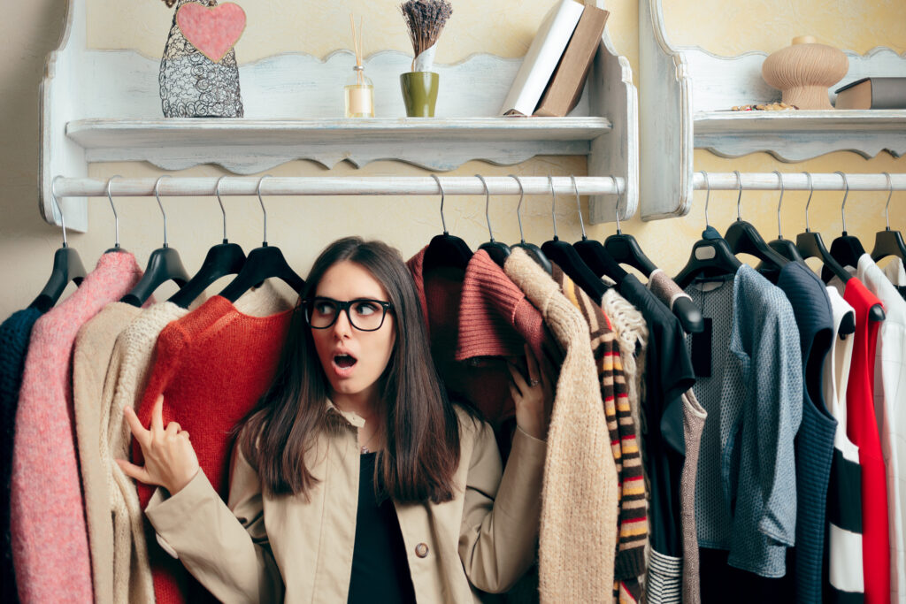 Winter capsule wardrobe. Hipster fashion stylist checking capsule wardrobe for cold season